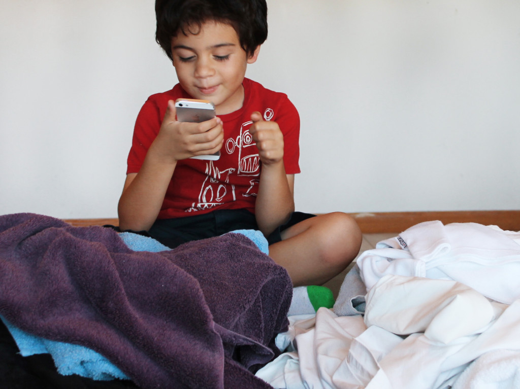 boy sorting laundry