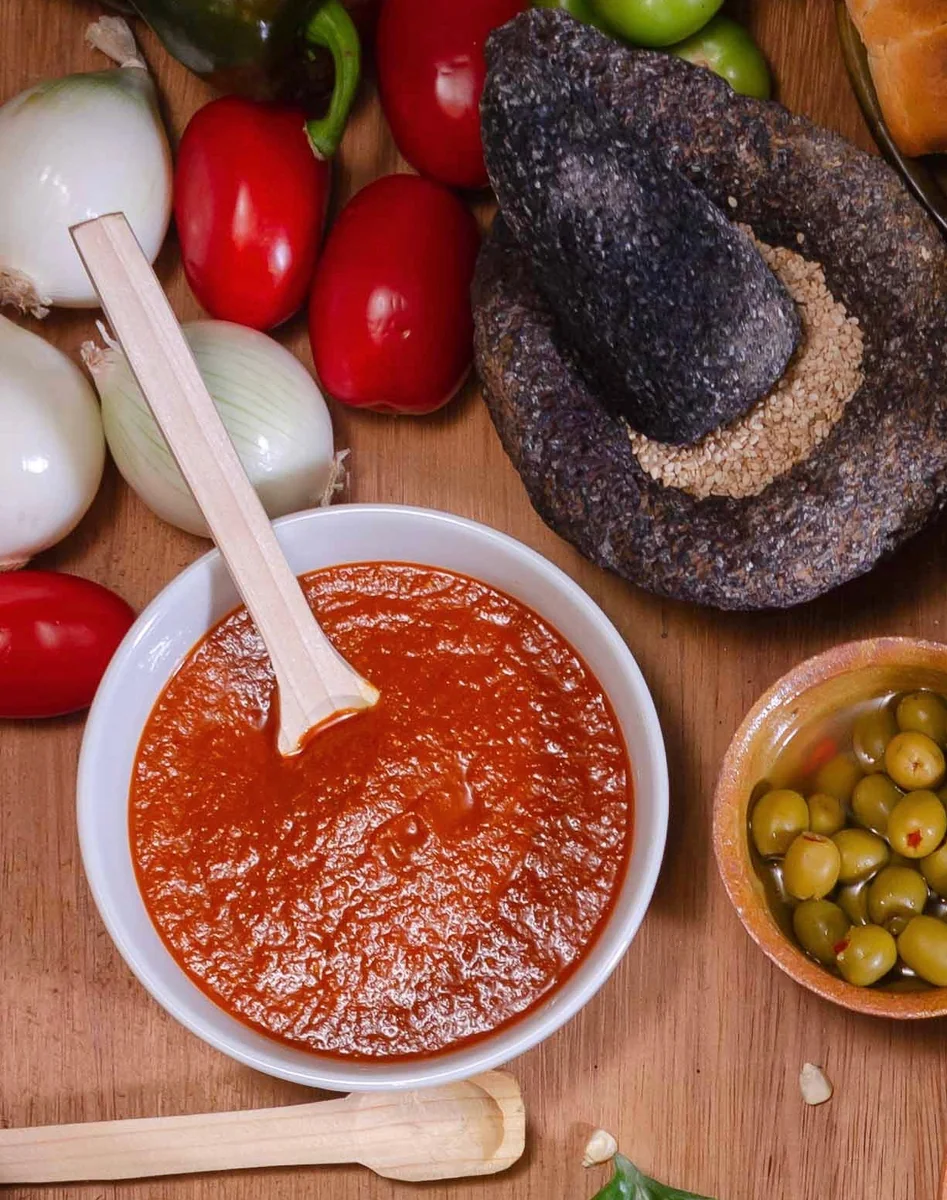 Bowl of Guatemalan recado sauce made from blended tomatoes, onion, garlic, and sweet pepper