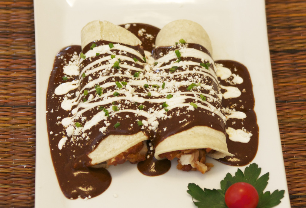 Top the enchiladas with some Mexican cream. 