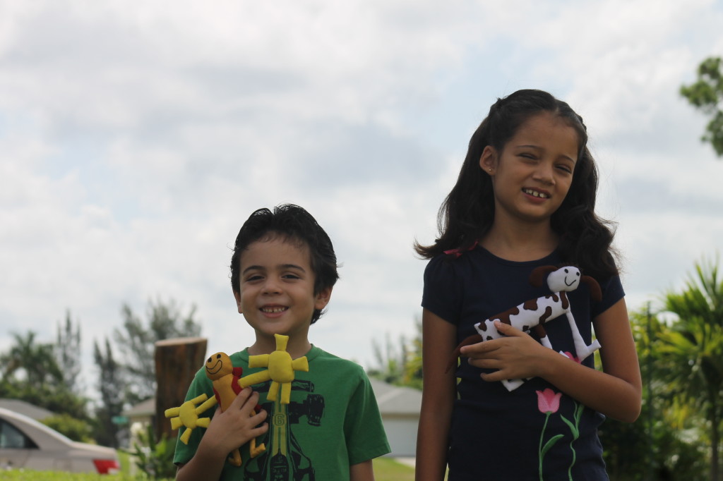 boy and girl with hand made dollss