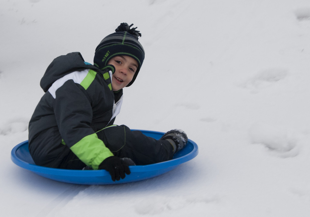 sledding in the snow