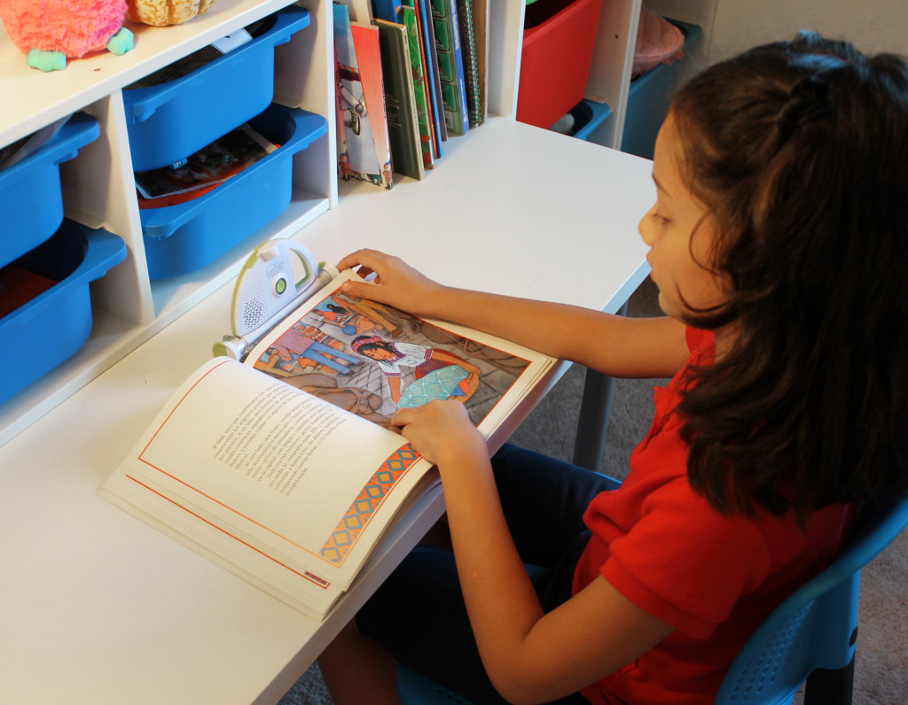 girl reading with sparkup reader