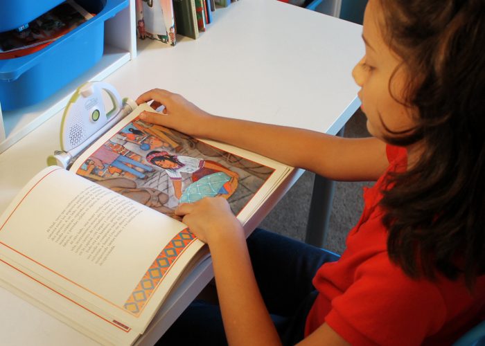 girl reading with sparkup reader