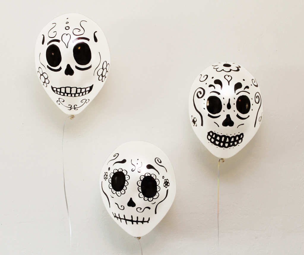 We got some white balloons and added some intricate skull designs using a black permanent market. These where so simple to make and they looked great! The best part was how easy and affordable these where and it only took a few minutes to make them.