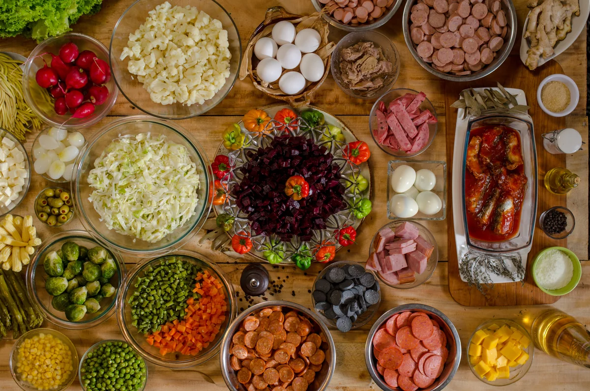 More than 50 ingredients laid out for making Guatemalan fiambre