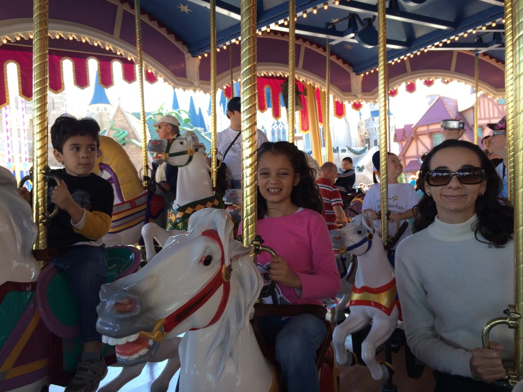 riding the carrousel at Disney