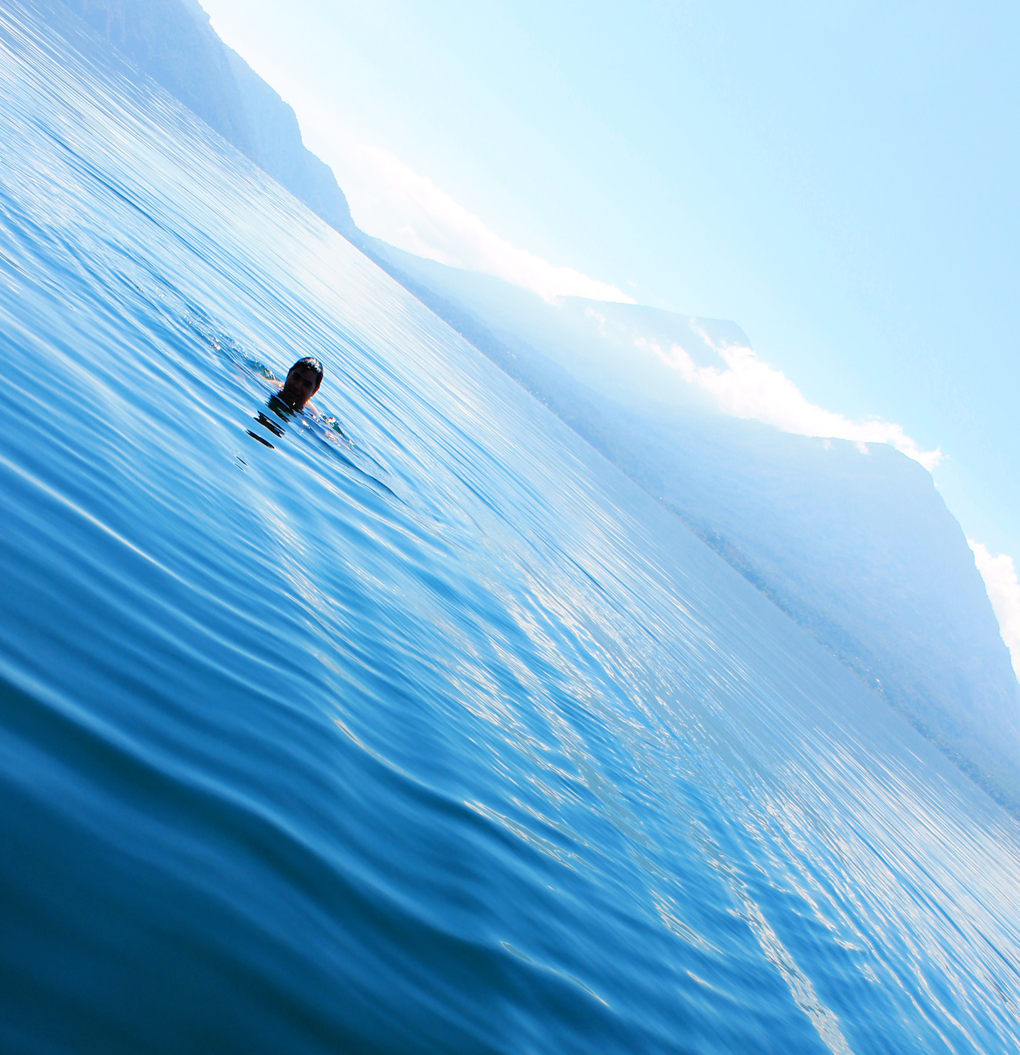 Swimming in the clear waters of lake Atitlan. Guatemala