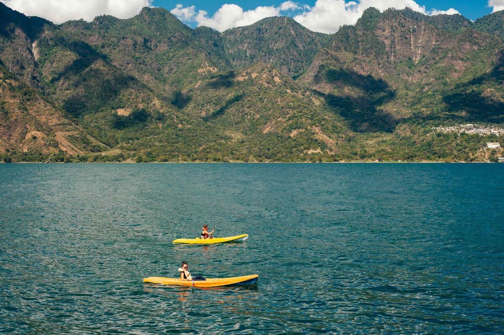 Kayaking on Lake Atitlán near Panajachel Guatemala with beautiful mountain views and calm lake waters, one of the best outdoor activities around Lake Atitlán.