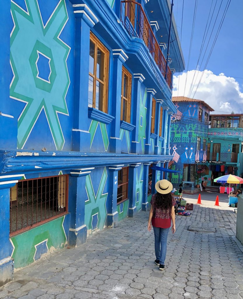 Colorful geometric murals and vibrant painted buildings in Santa Catarina Palopó, one of the most beautiful towns near Lake Atitlán in Guatemala.