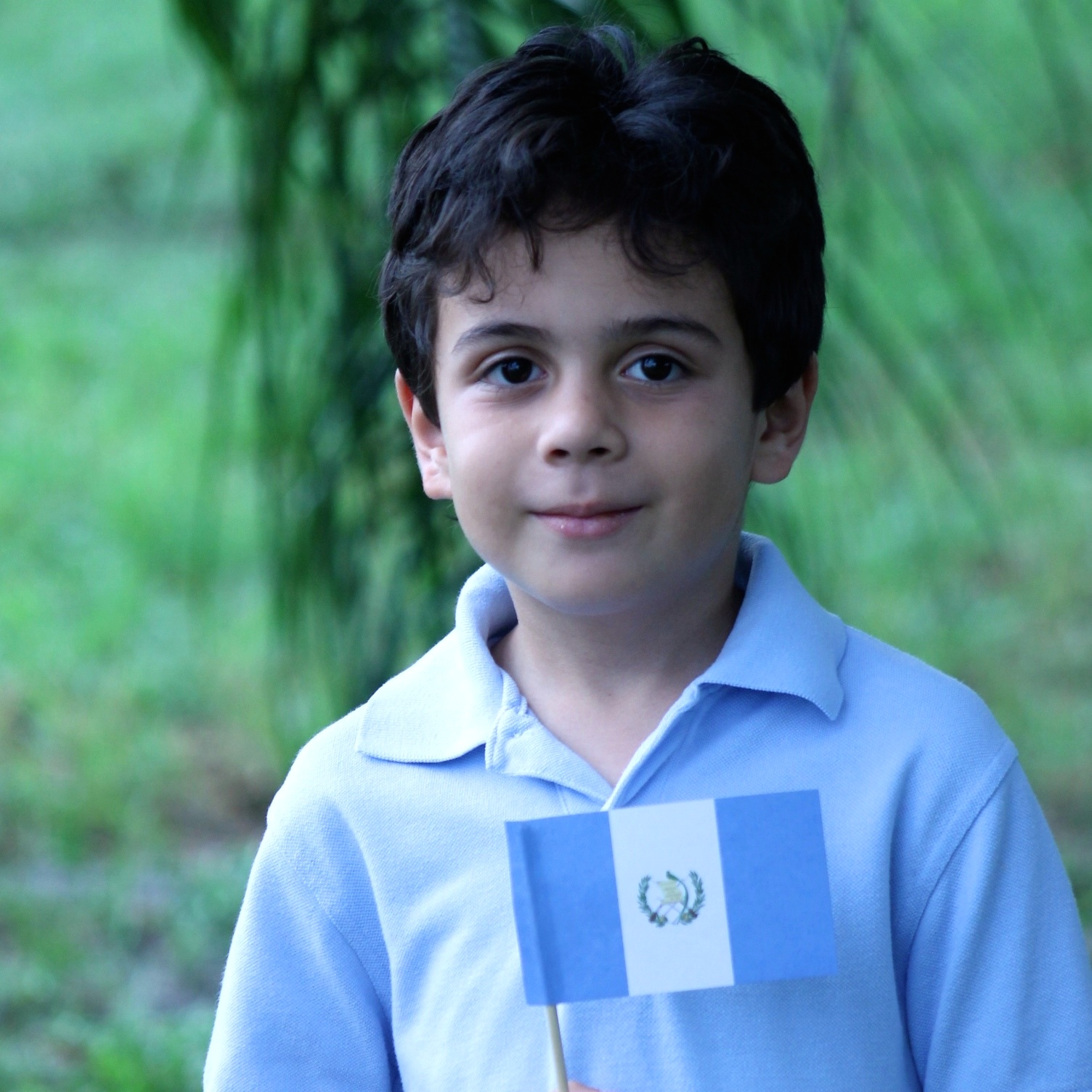 Child with Guatemalan flag. Guatema