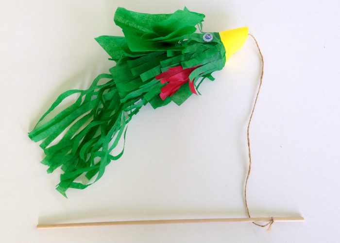Quetzal bird craft made of toilet paper tube. DIY project to celebrate Guatemala's independence. Guatemalan craft.