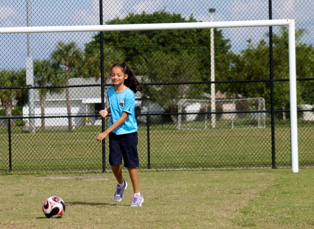 girl playing soccer