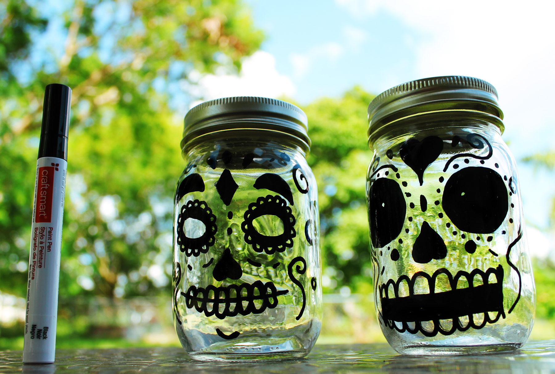 Day of the Dead glow in the dark lanterns made with mason jars.