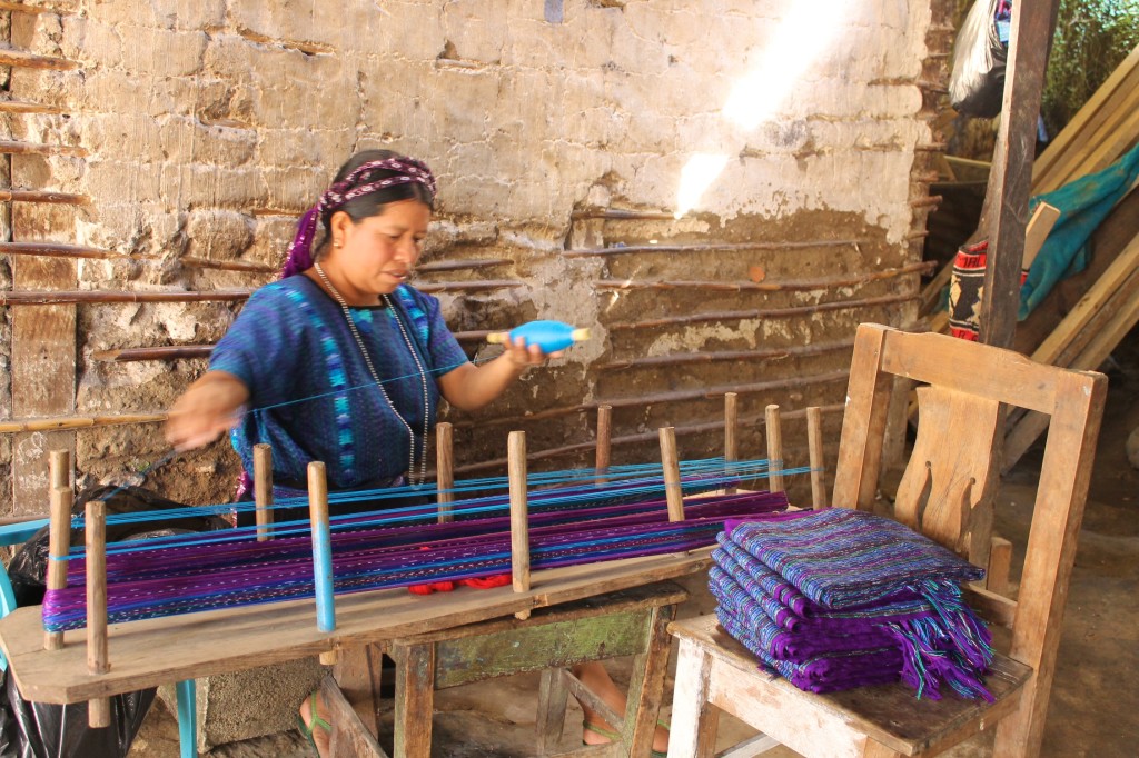 mayan woman weaving in San Antonio Palopo in Lake Atitlan Guatemala