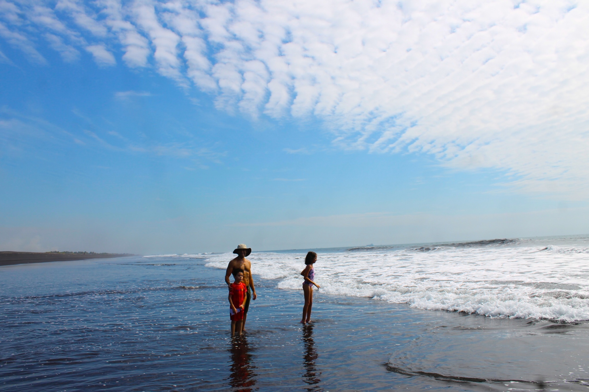 family at the beach in Guatemala's Pacific coast