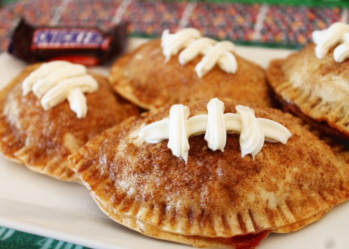 These Football chocolate strawberry empanadas with snickers are perfect for the big game party!
