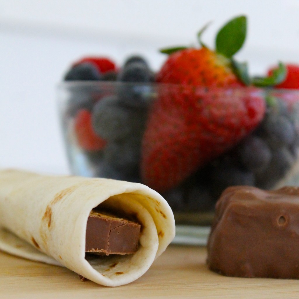 Chocolate tacos with berry sauce Snickers Almond