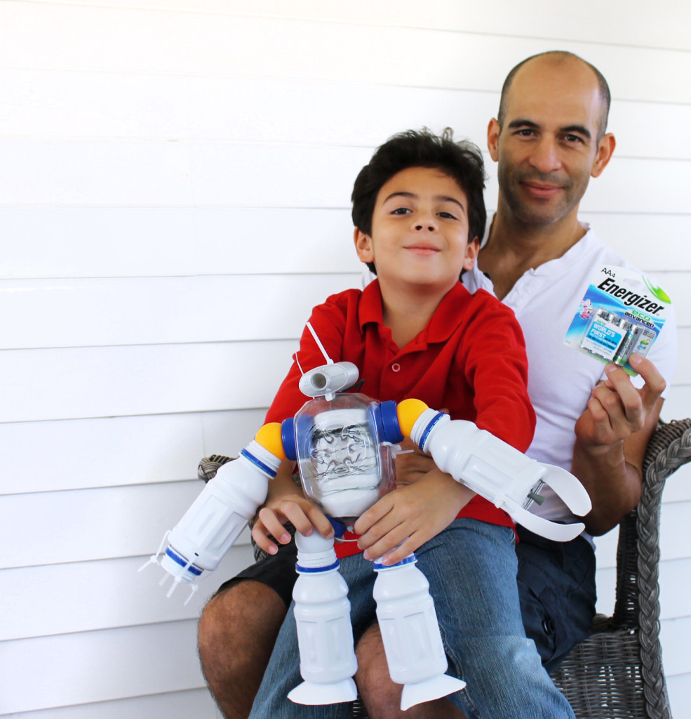 father and son with recycled toy