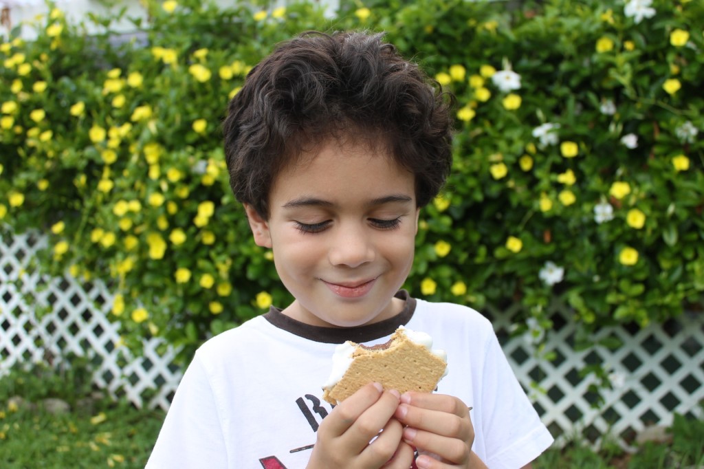 boy eating s'mores