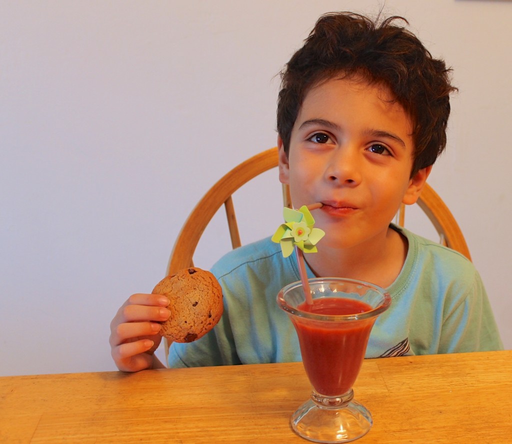 After school snacking. drinking Naked Juice and eating a Fiber One chocolate chip cookie. 