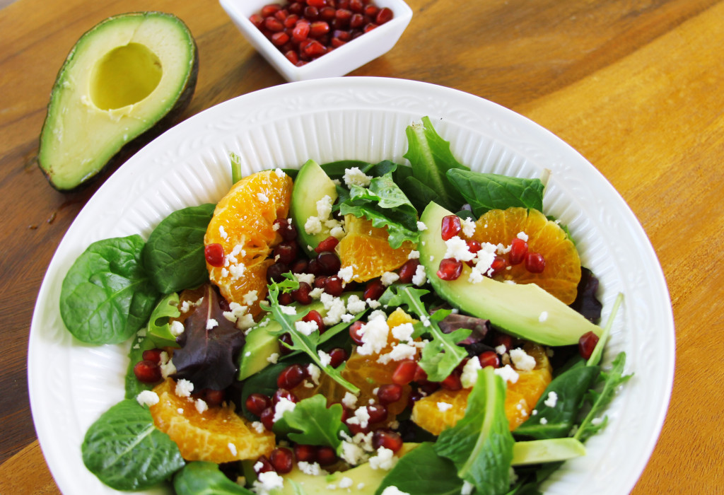 Avocado Tangerine salad with spicy vinaigrette top view three quarters