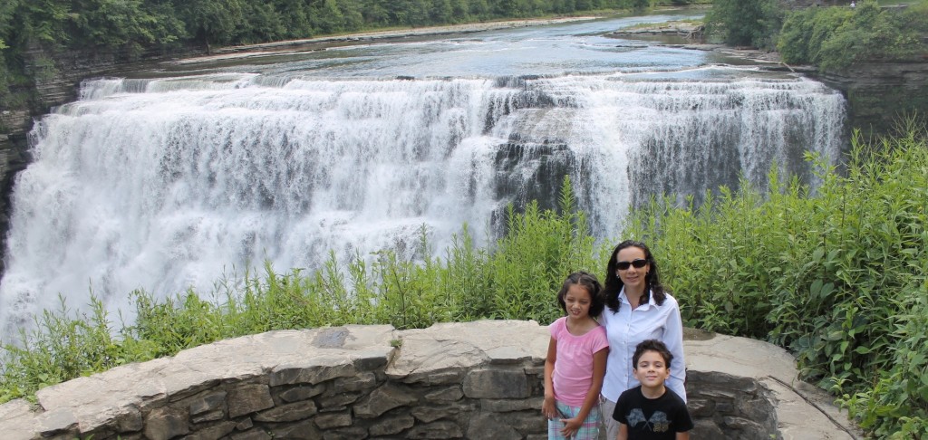 family in front of waterfall in New York State