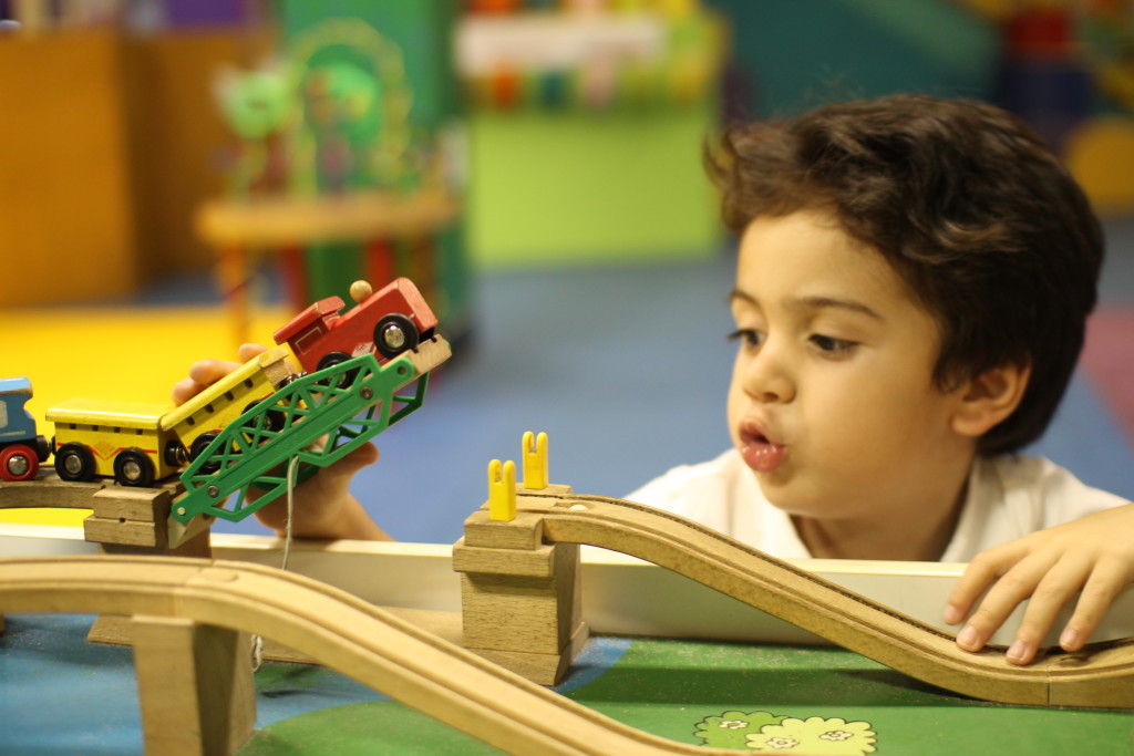 kid playing with trains