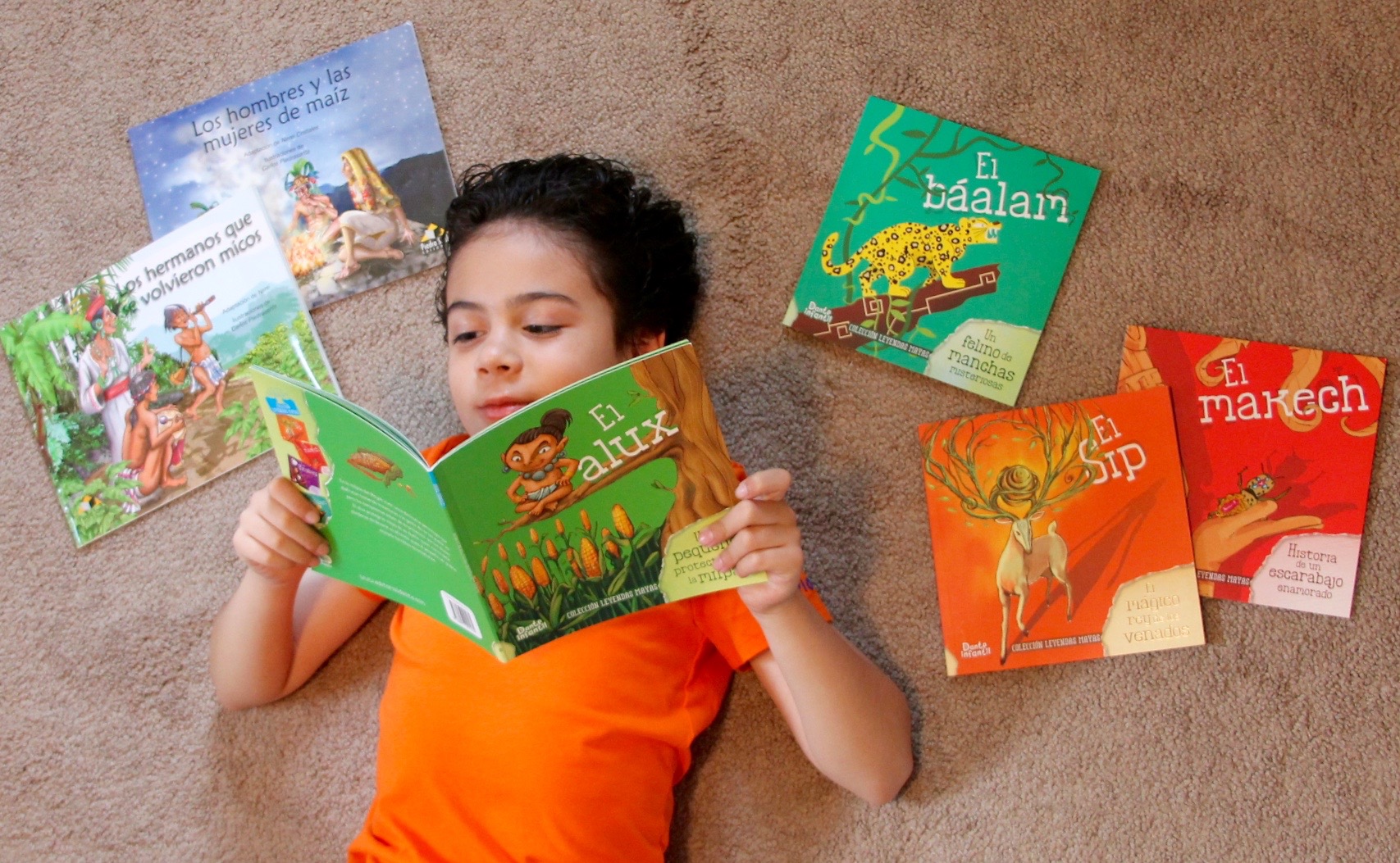 boy reading books in Spanish