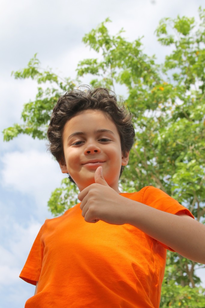 teaching leadership skills boy with a thumbs up