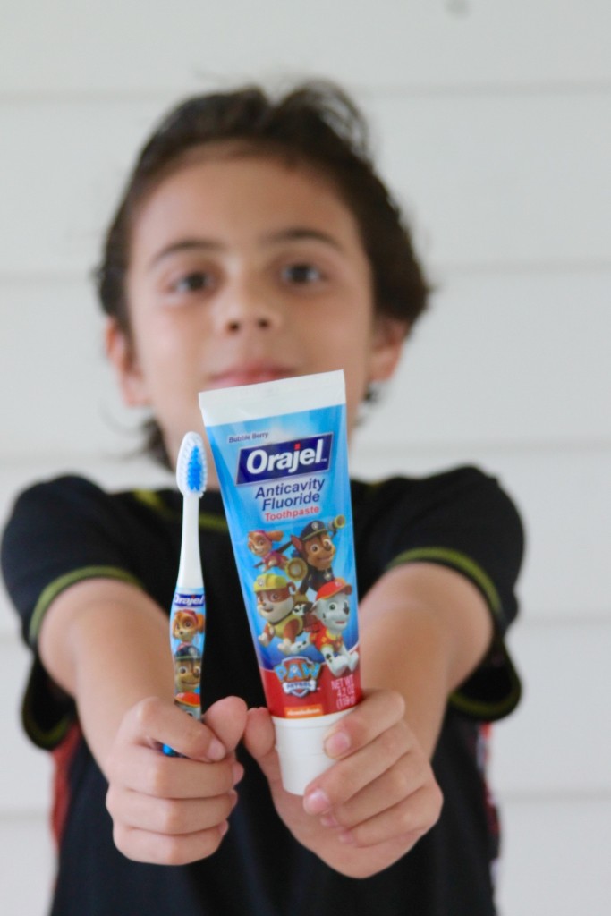 brushing your teeth with Orajel