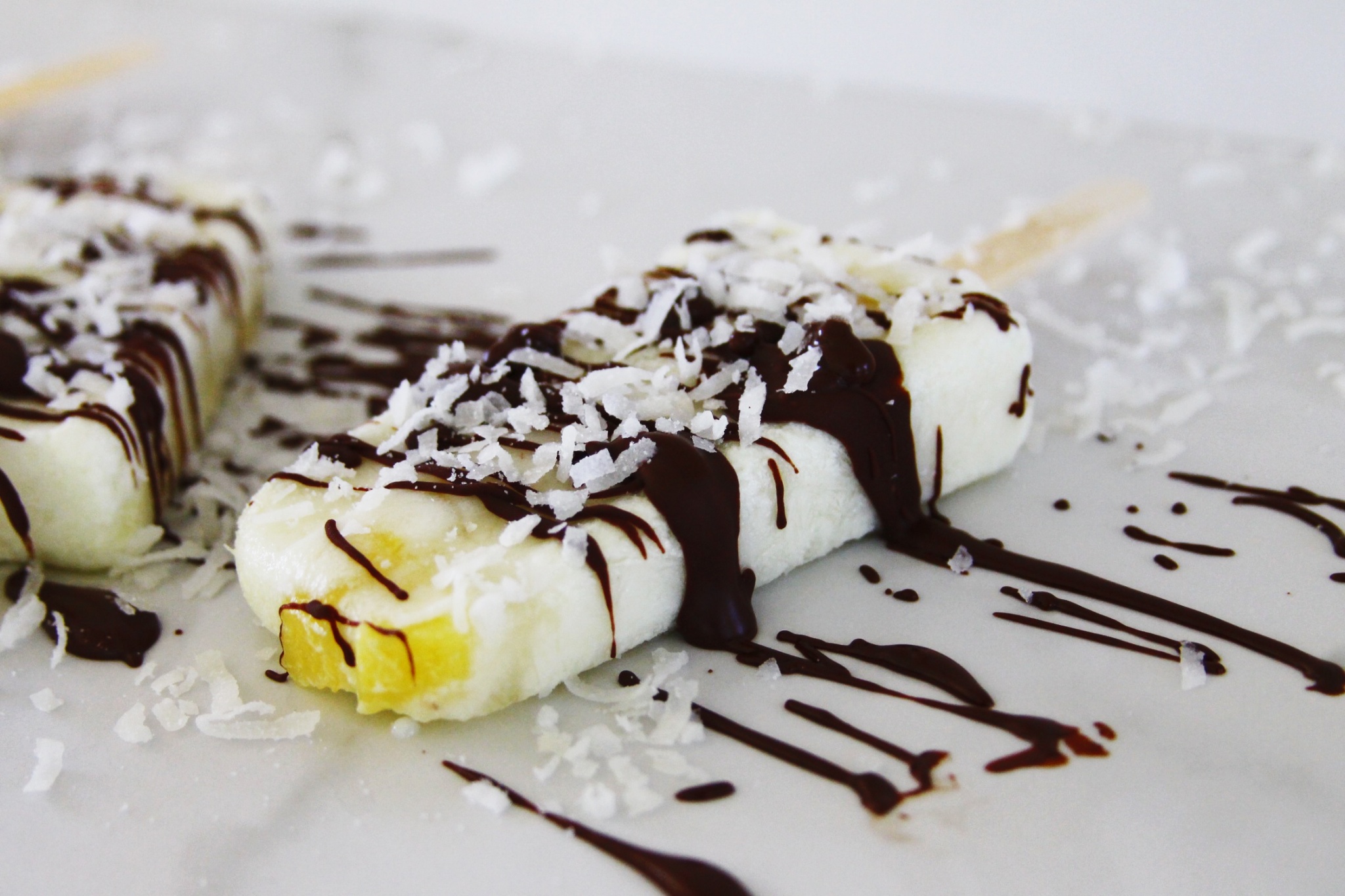 chocolate drizzled vegan coconut and pineapple popsicles