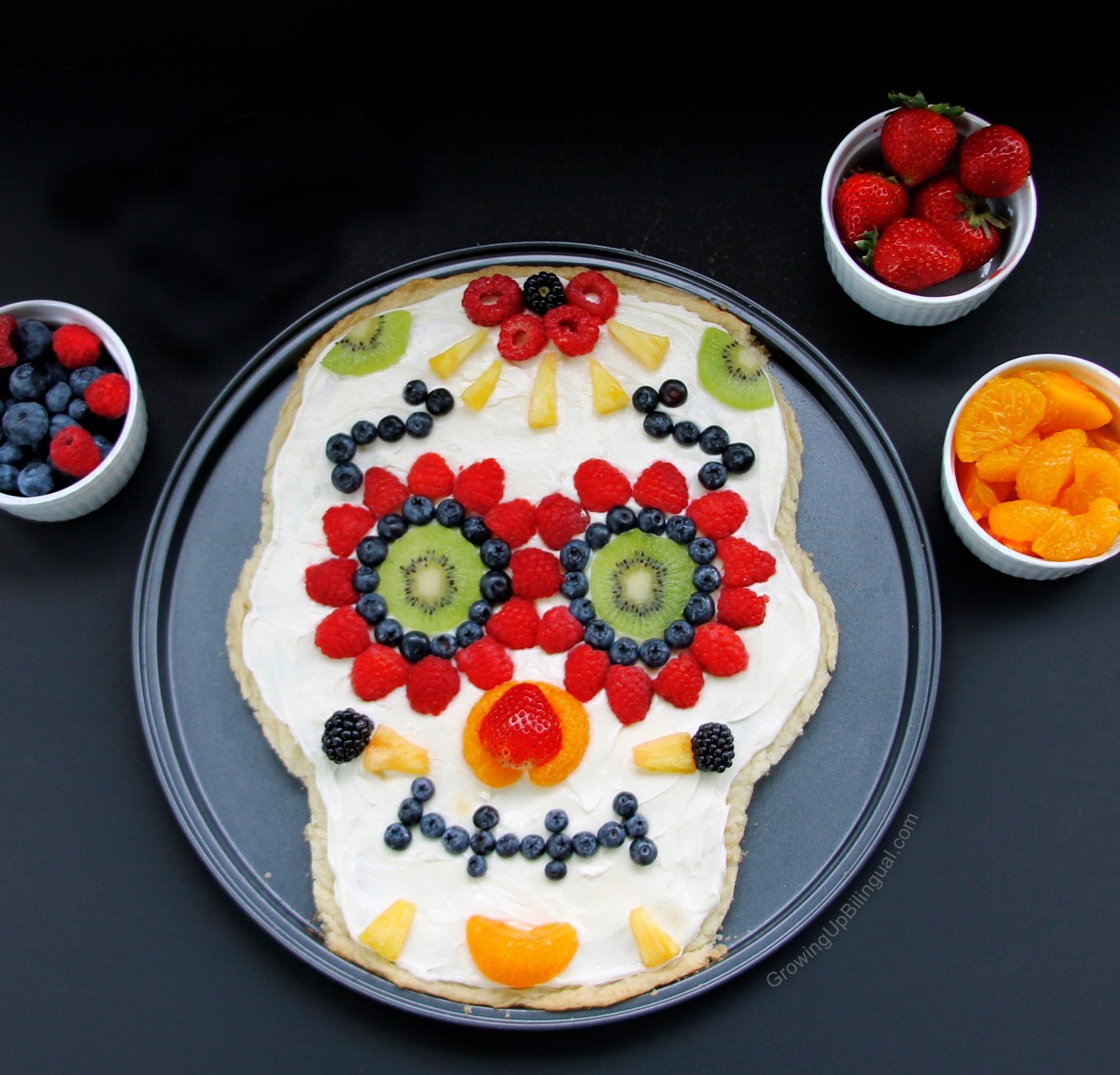 Healthy Day of the Dead sugar skull pizza topped with fruit