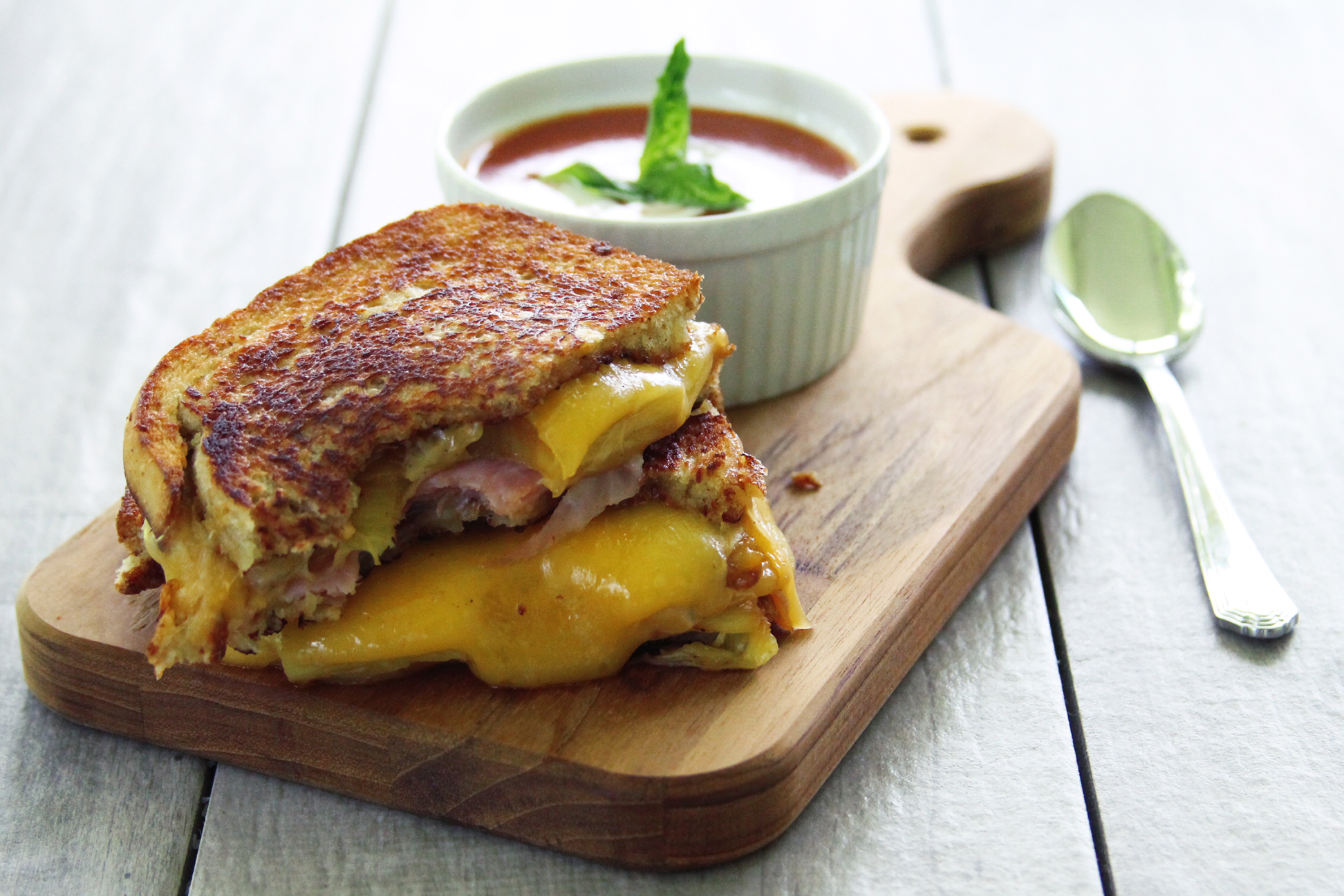 This take on the traditional grilled ham and cheese sandwich adds some tropical flavor with grilled pineapple and teriyaki mayo.