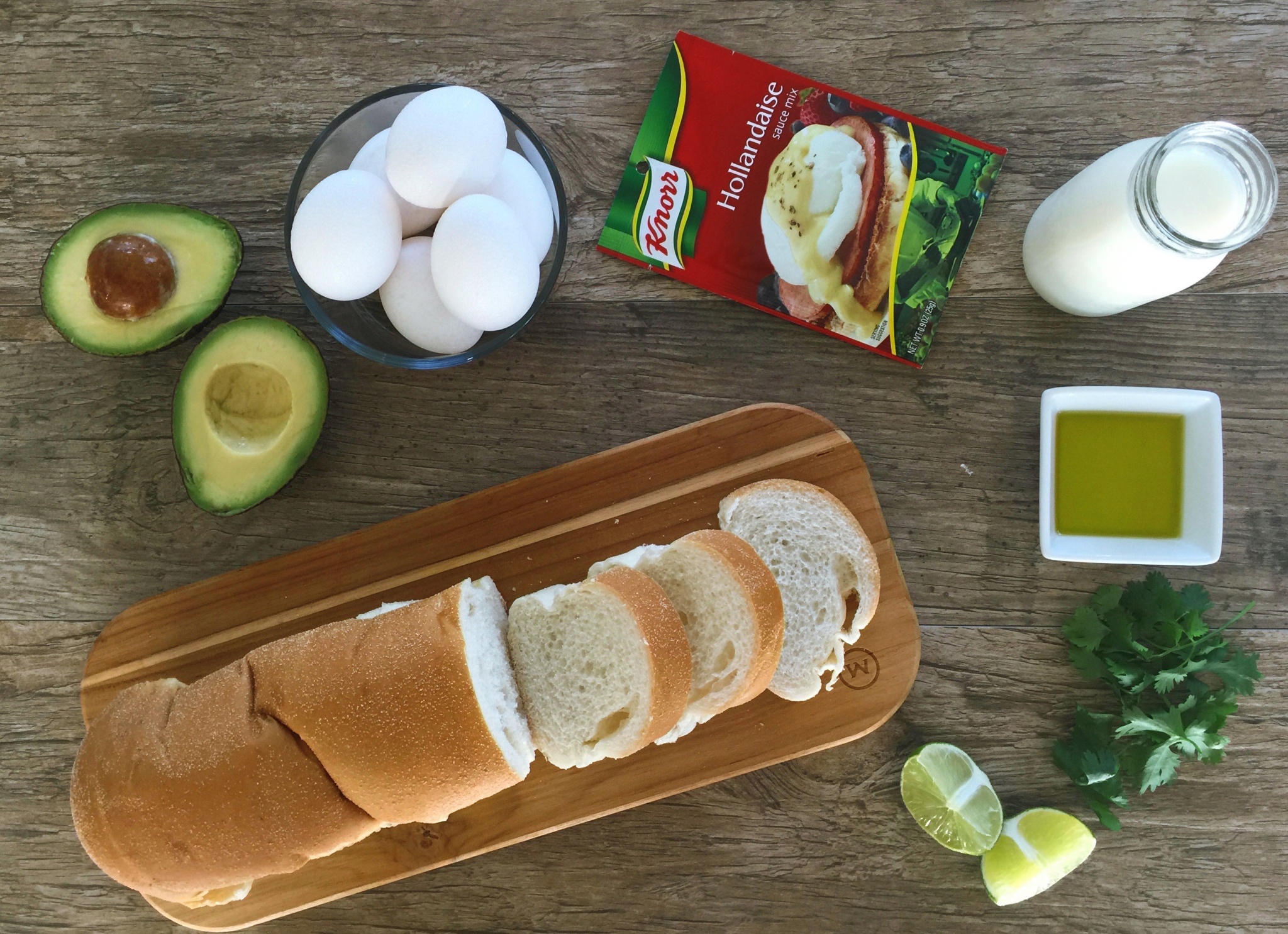 Avocado toast with eggs Benedict and cilantro hollandaise sauce