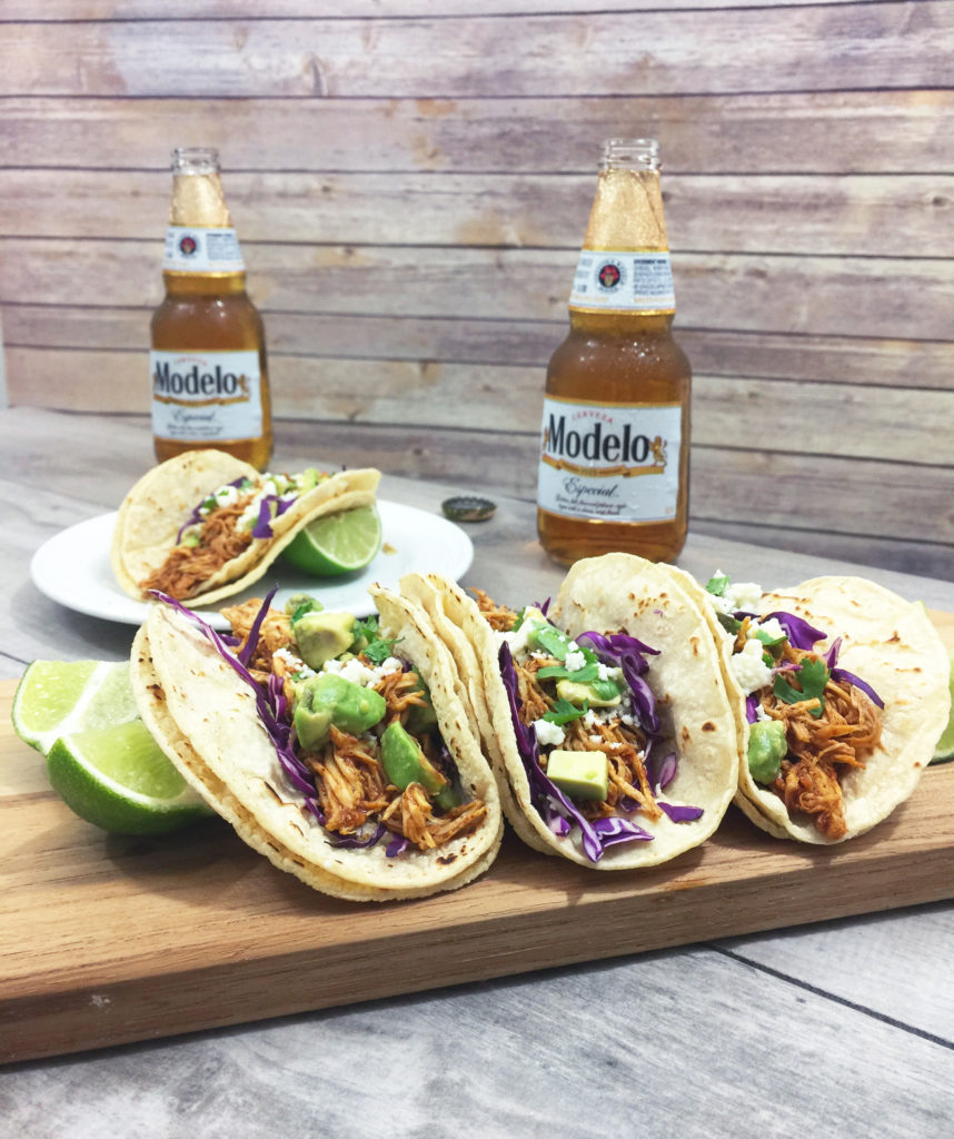 chipotle beer braised tacos and Modelo beer 