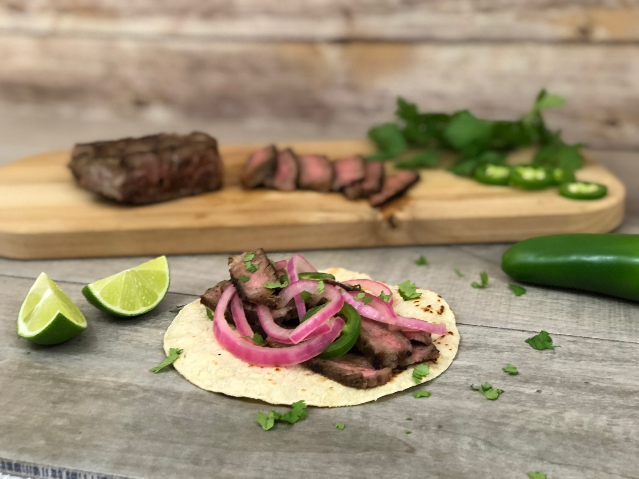 grilled skirt steak tacos with pickled onions