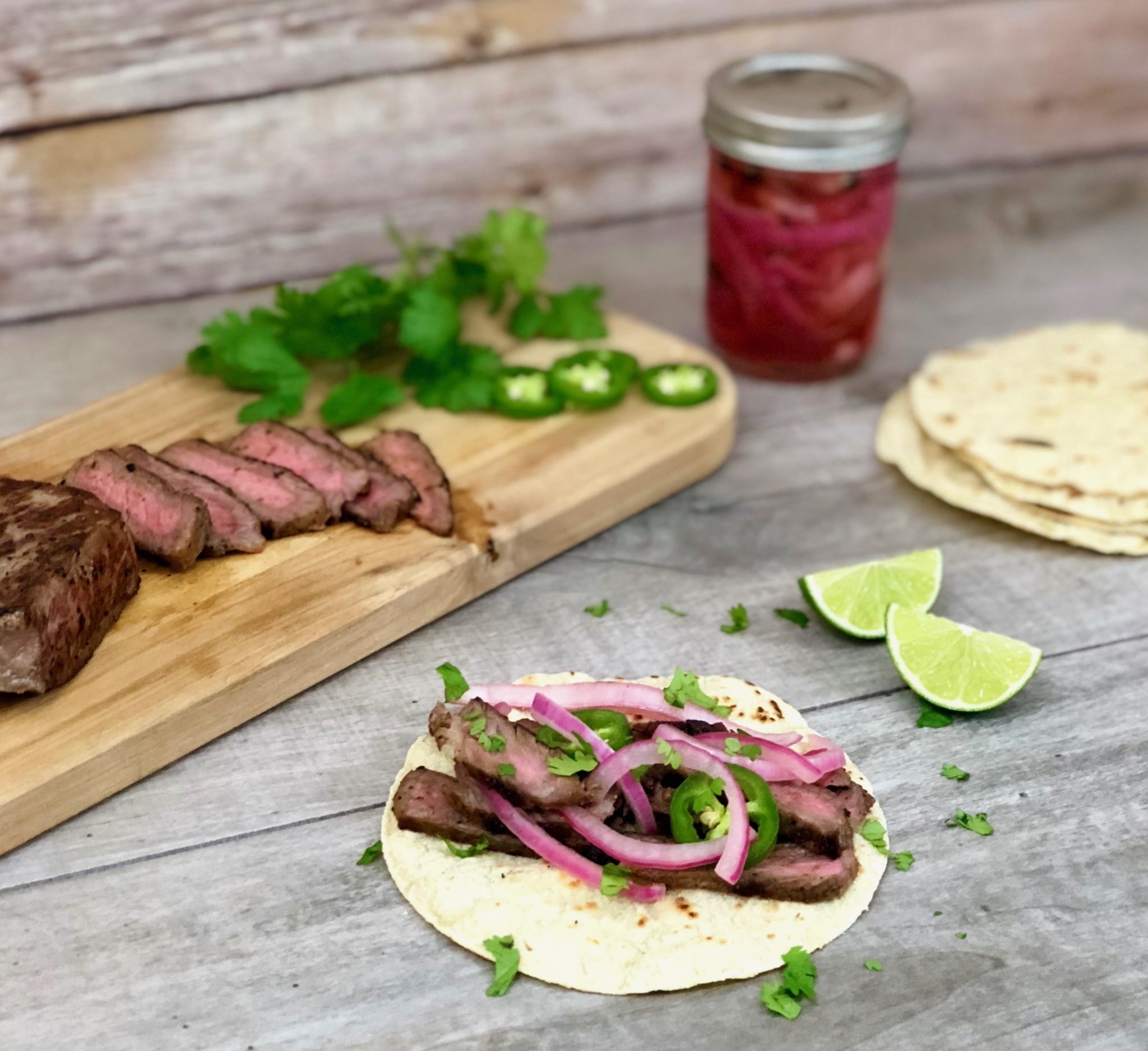 grilled skirt steak tacos with pickled onions
