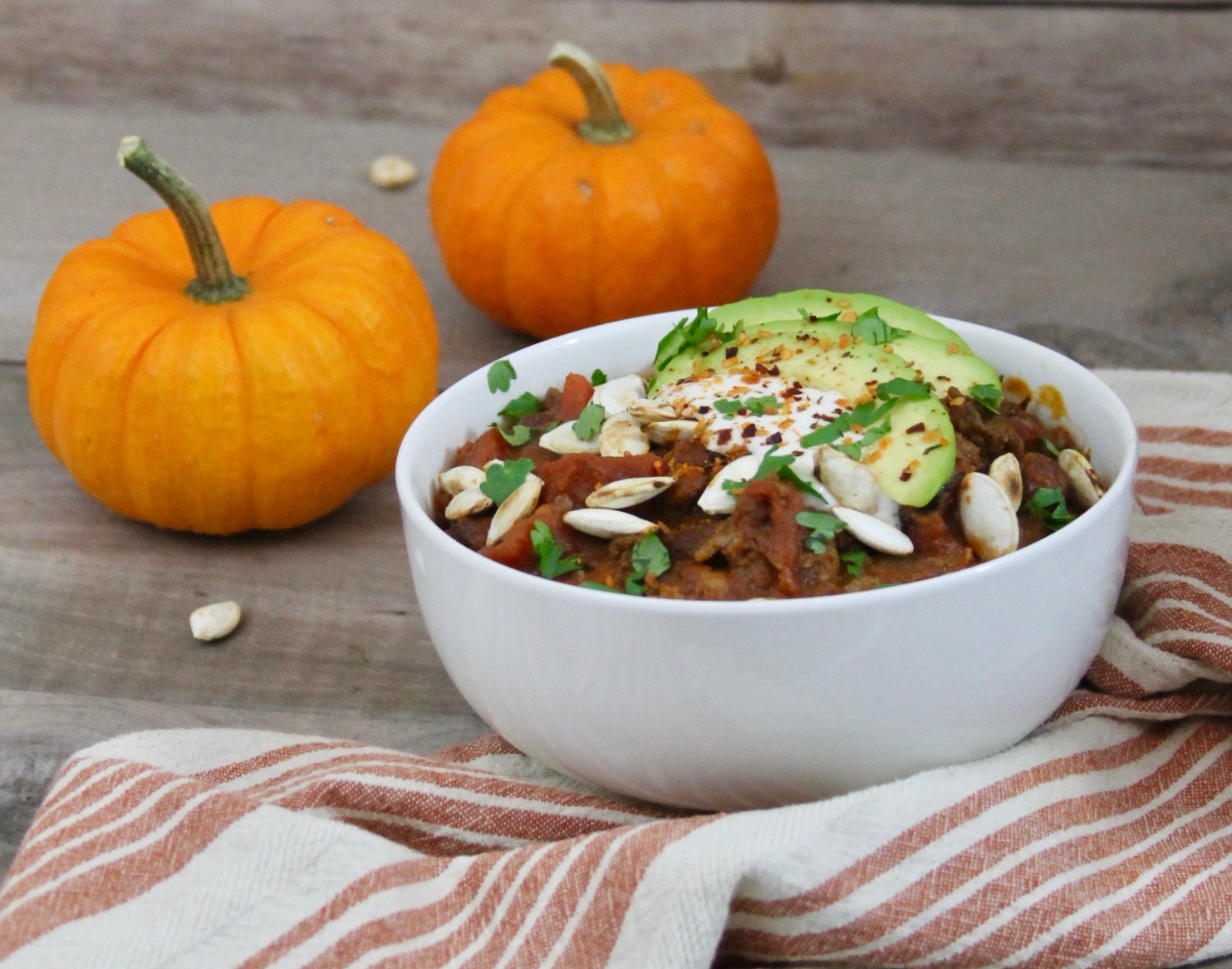 This chipotle beef pumpkin chili takes chili to a whole new level with its subtle sweetness and smoky heat for a fall dish that is sure to become this season's favorite slow cooker chili recipe.