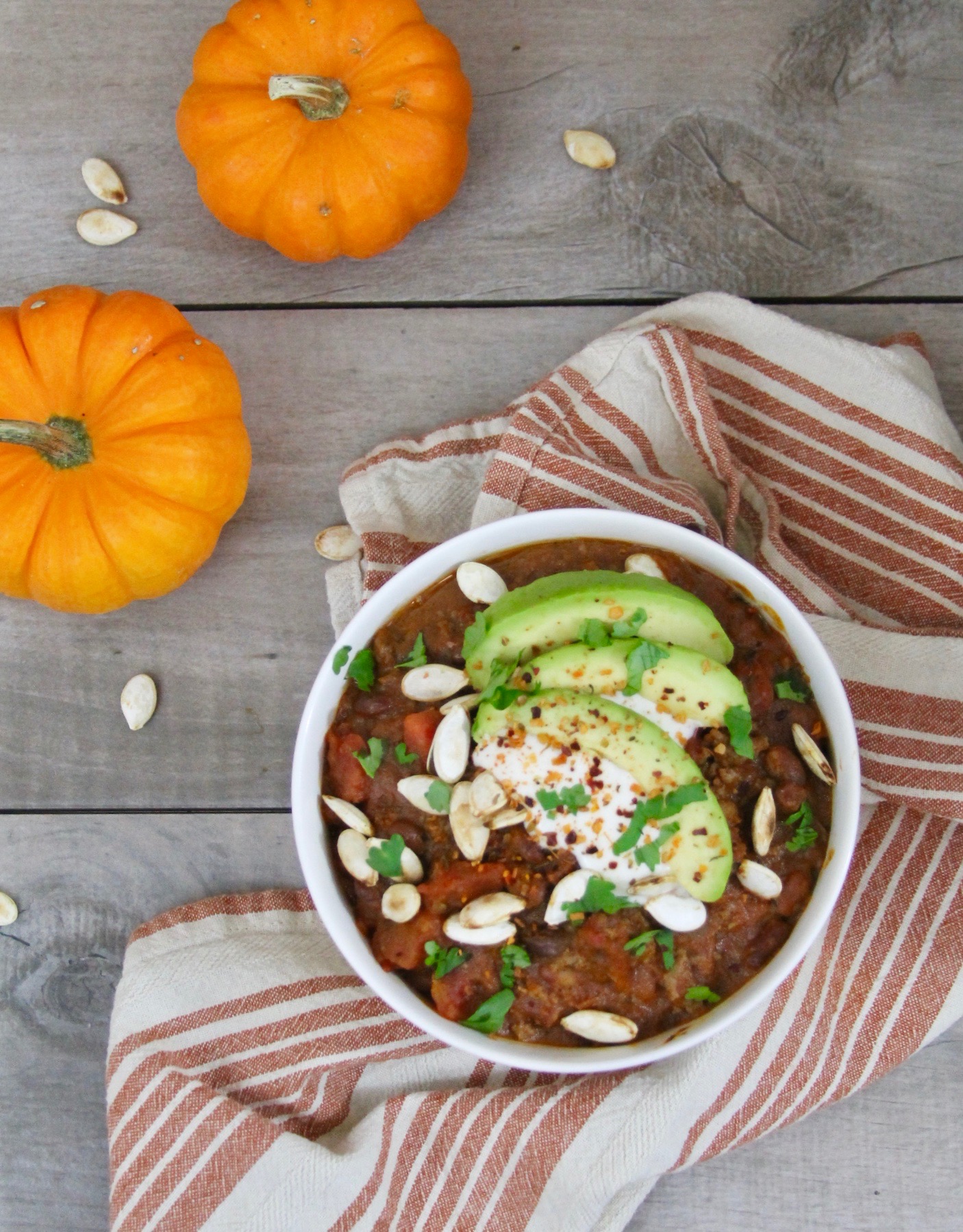 This chipotle beef pumpkin chili takes chili to a whole new level with its subtle sweetness and smoky heat for a fall dish that is sure to become this season's favorite slow cooker chili recipe.