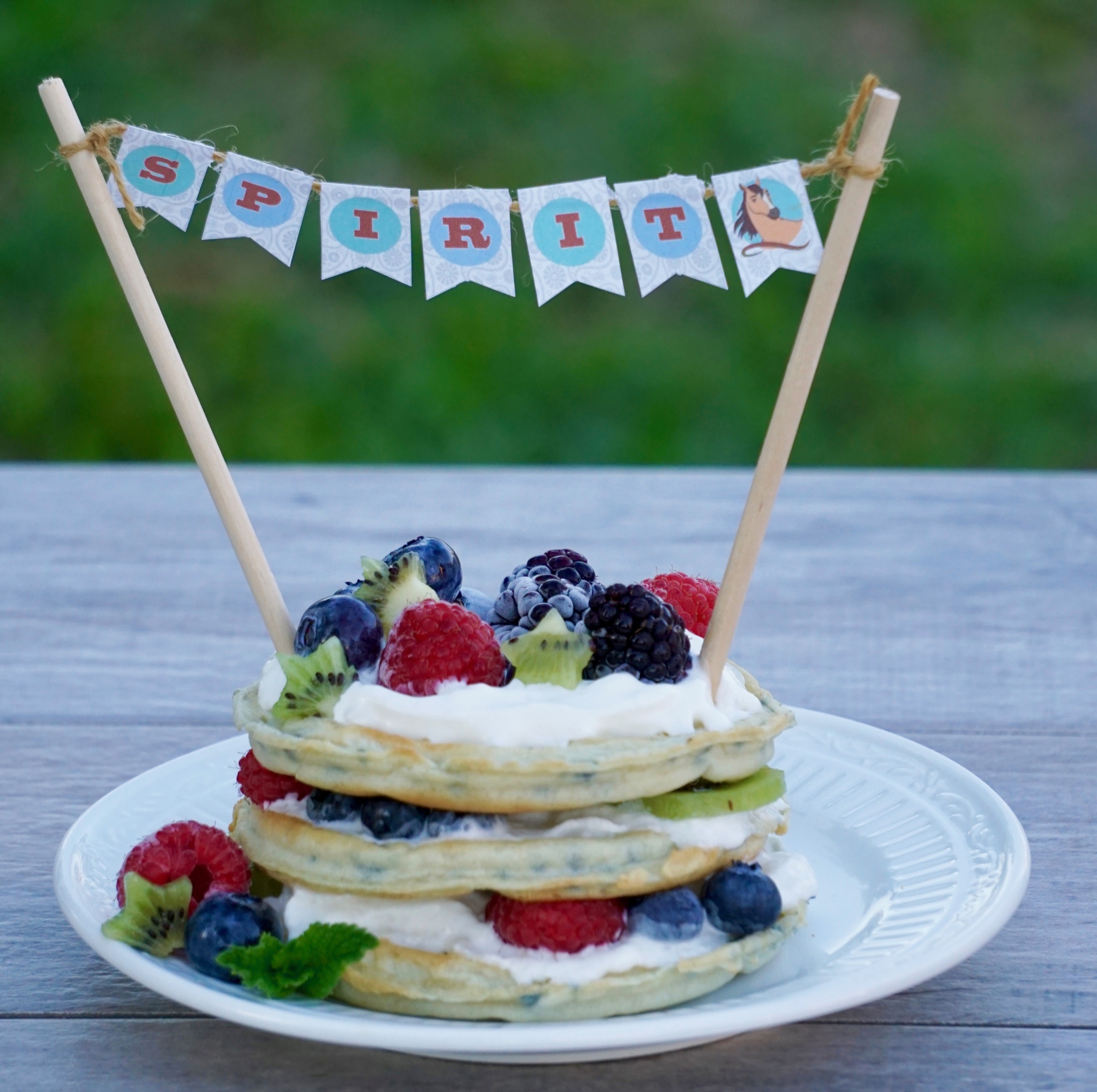Berries and kiwi waffle cake with Spirit Riding Free printable cake banner