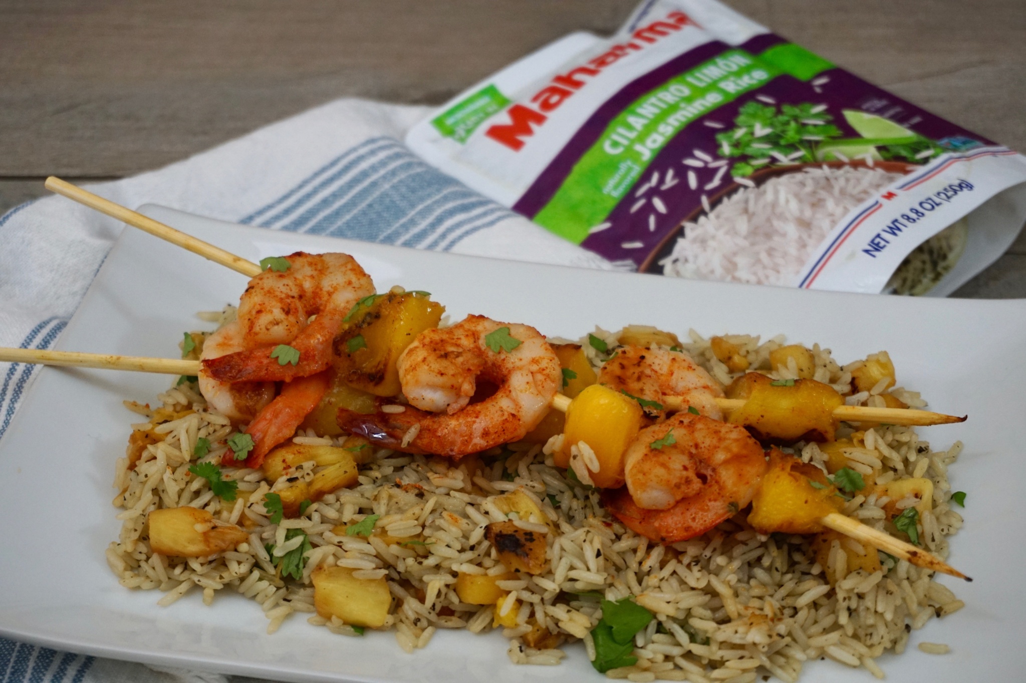 Shrimp and Mango Skewers Over Grilled Pineapple Cilantro Lime Rice 