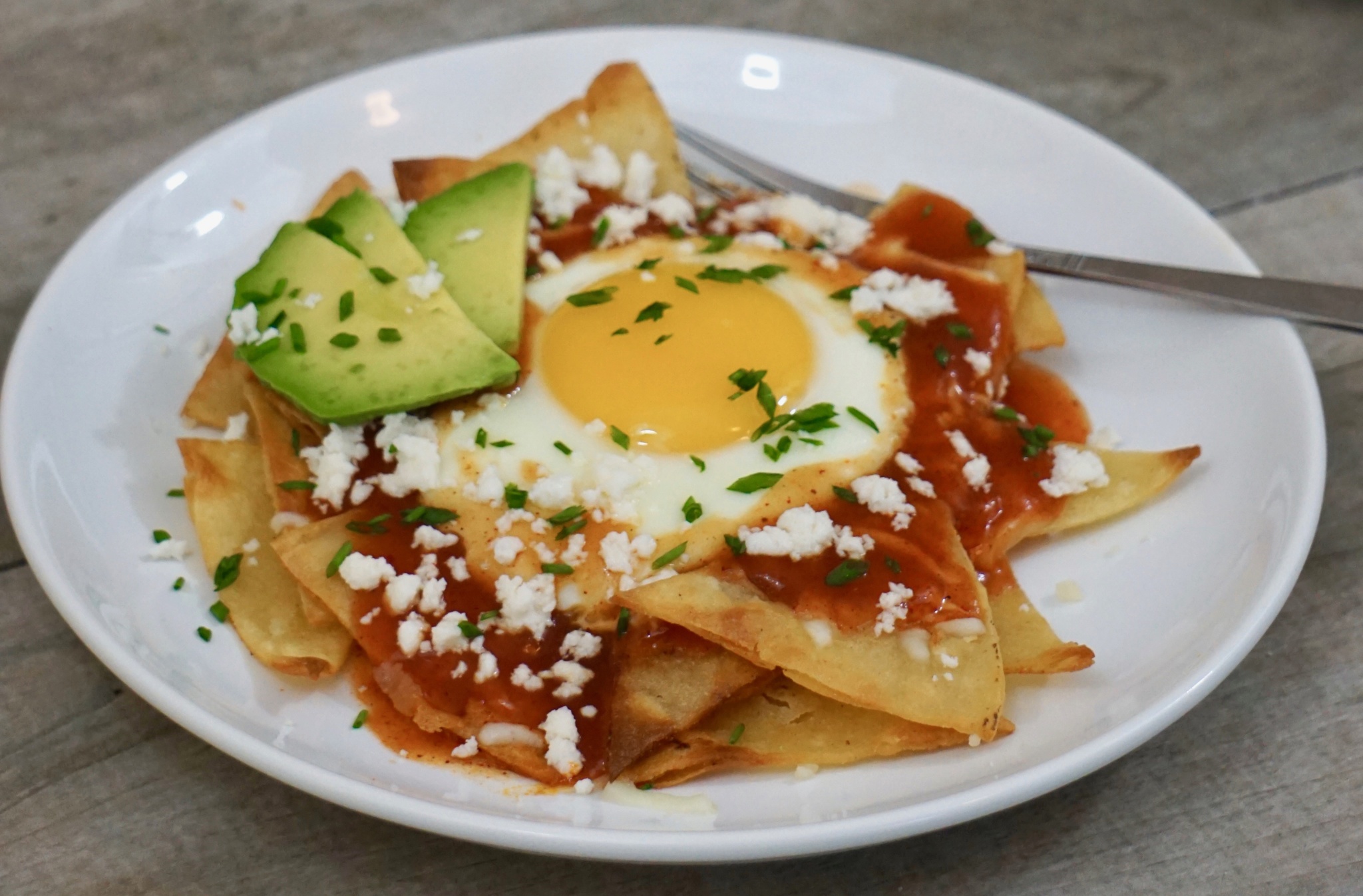 red chilaquiles with fried egg breakfast recipe