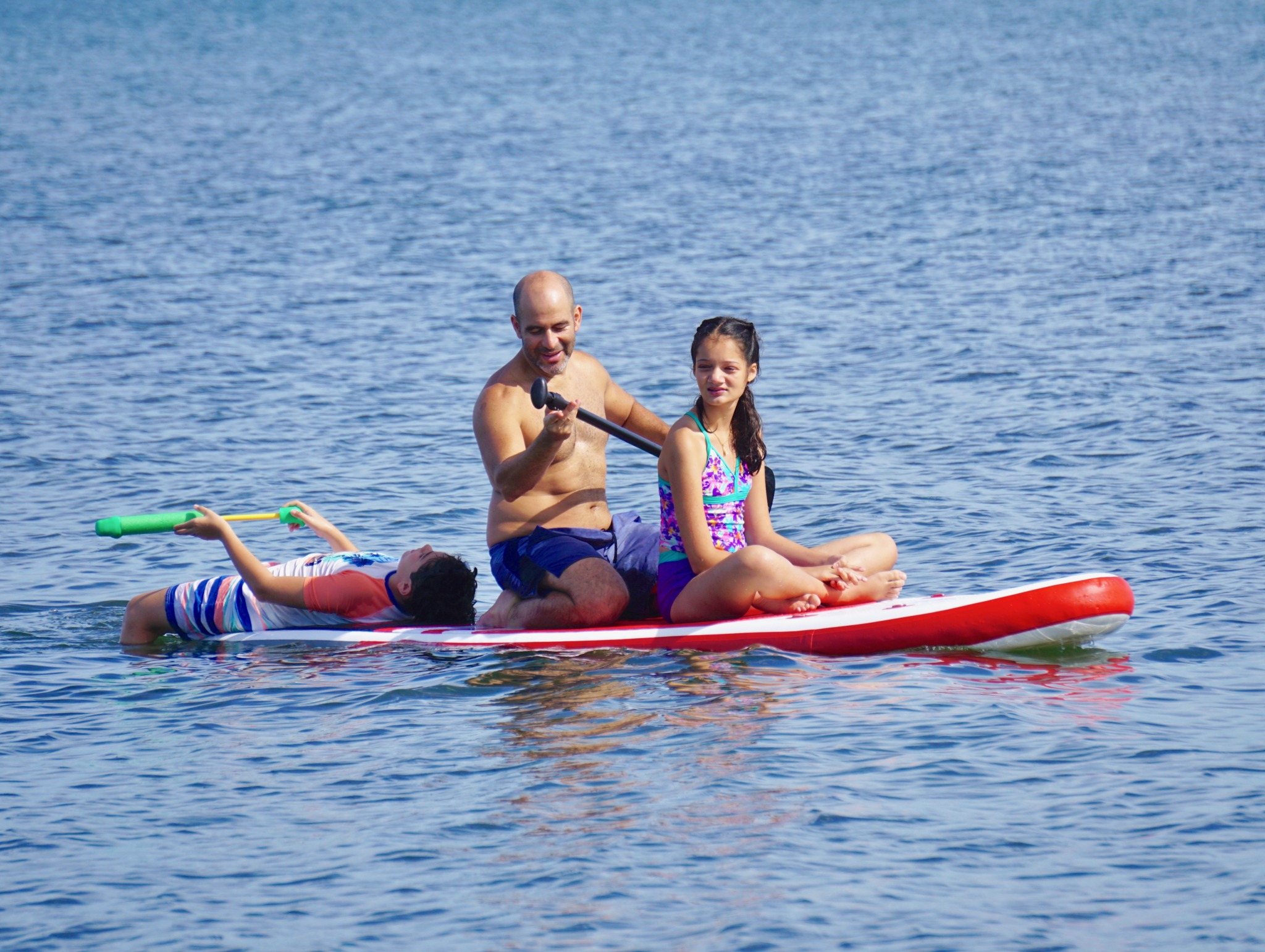 family paddle boarding