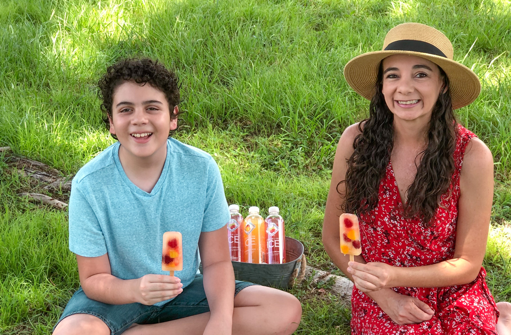 enjoying fruit popsicles in the back yard