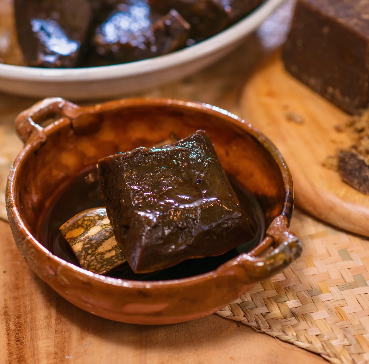 A serving of Guatemalan ayote en miel, candied squash in dark syrup