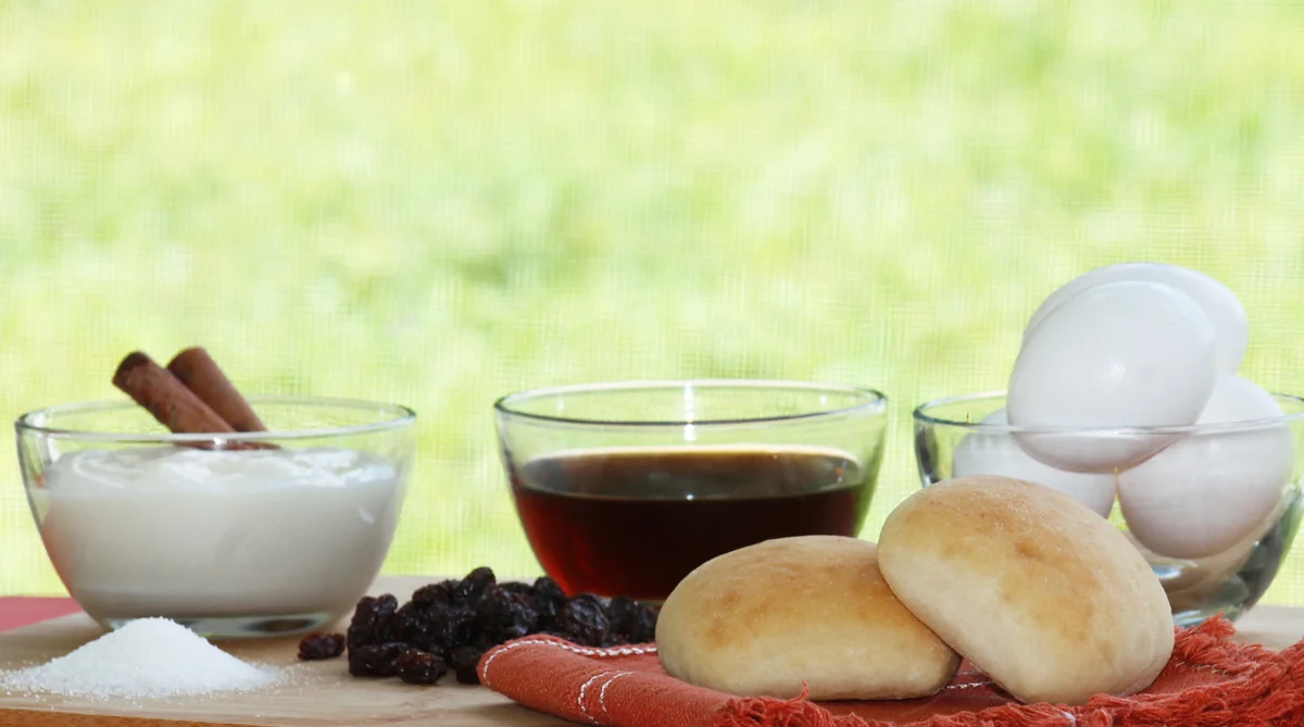 Ingredients for Guatemalan molletes: pan dulce, eggs, panela, and spices