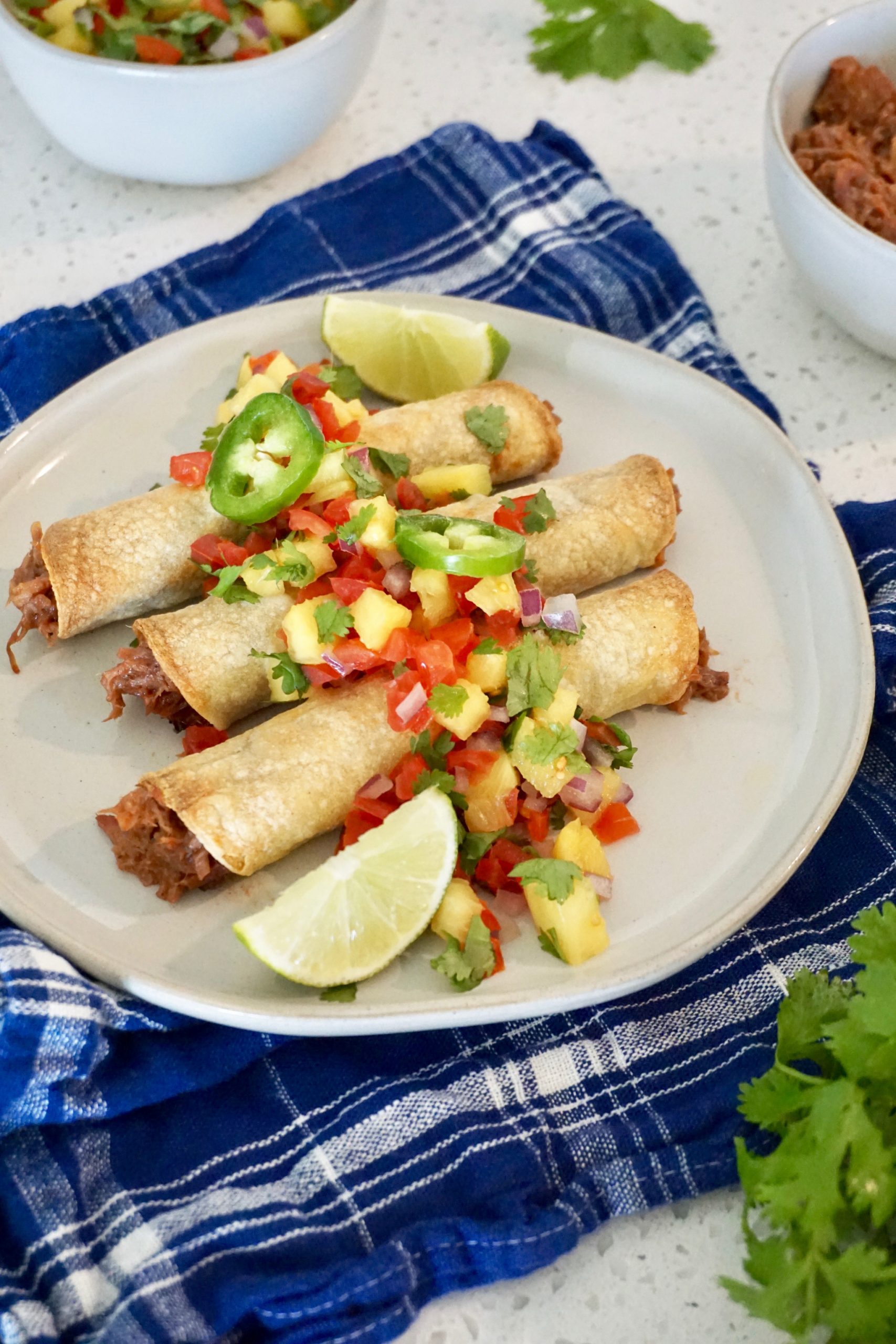 Pulled pork taquitos with pineapple salsa