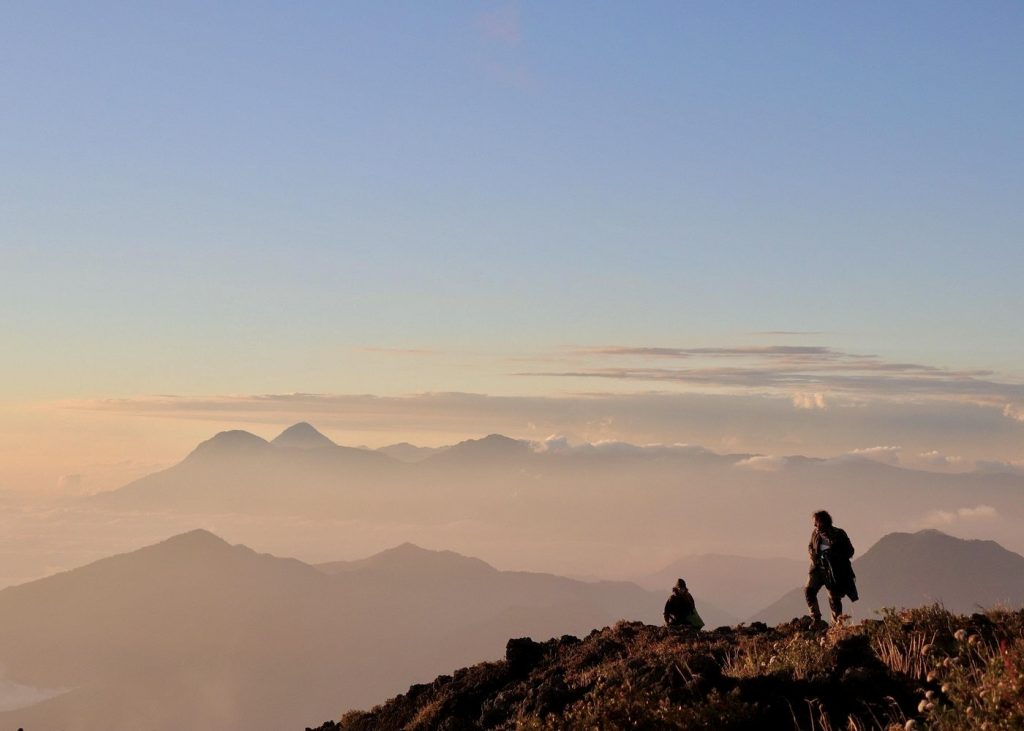 Hikers near the summit of Volcán Atitlán with volcano views in Guatemala