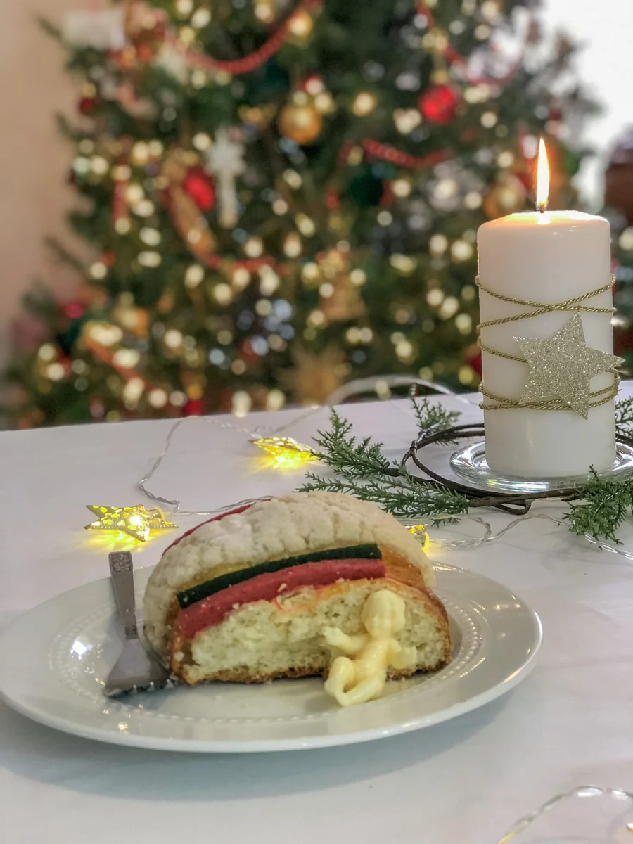 The baby Jesus figure hidden inside a rosca de reyes