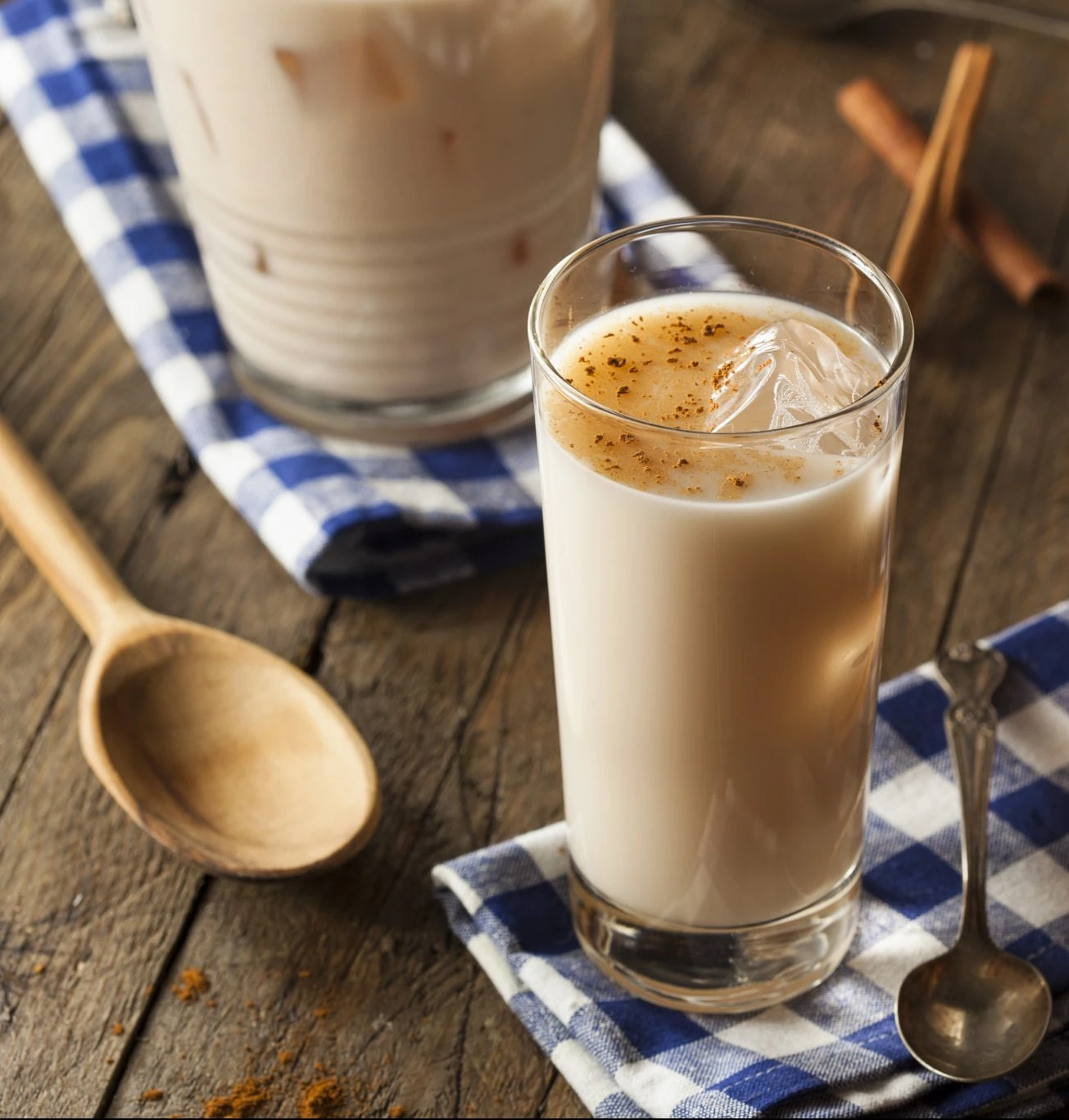 Glass of Guatemalan horchata over ice dusted with cinnamon